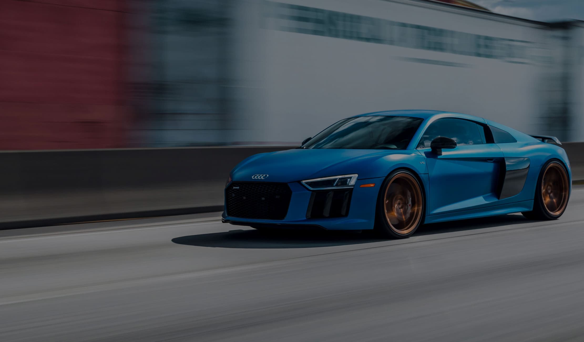 Blue Audi on a road