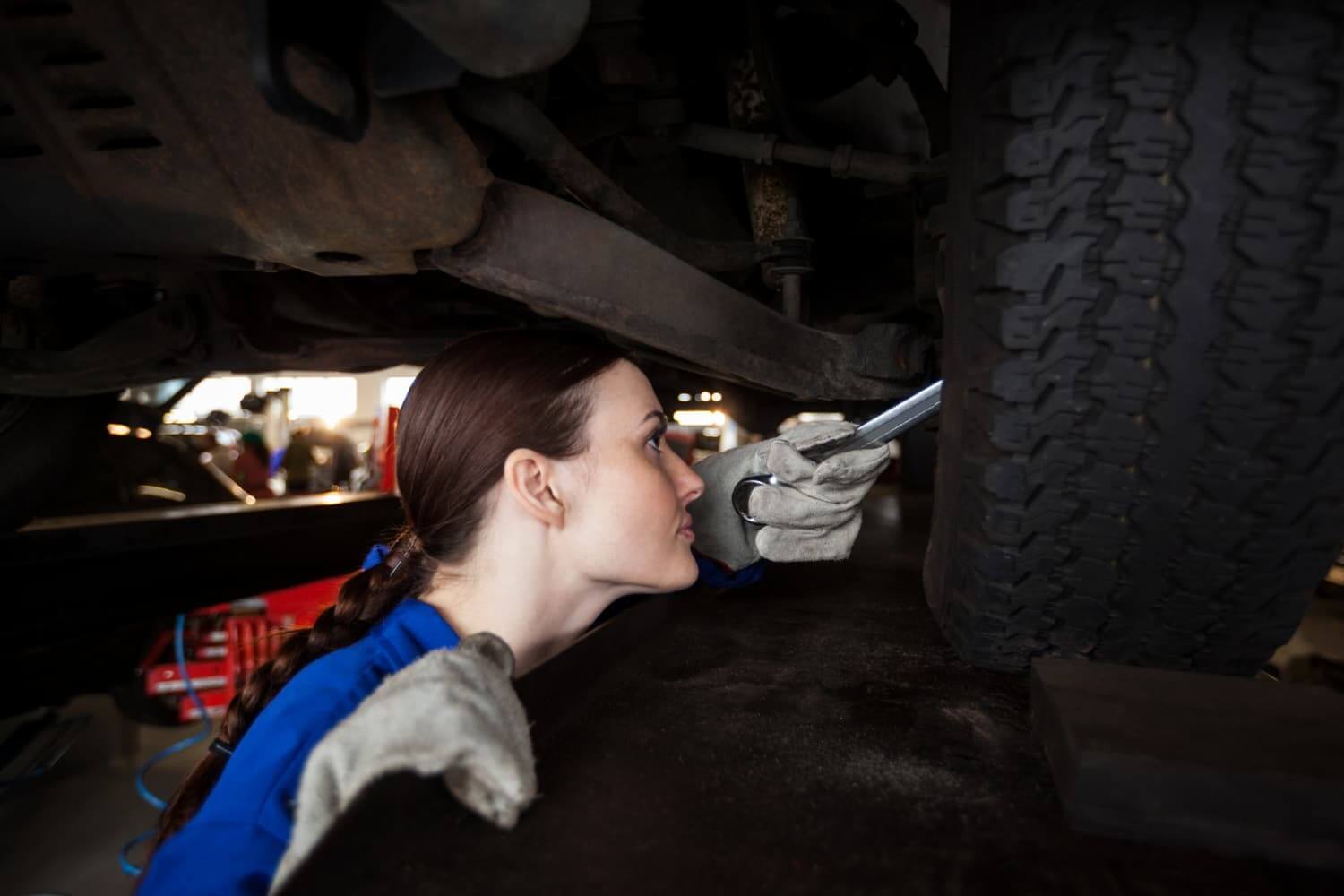 Repair tech fixing tire