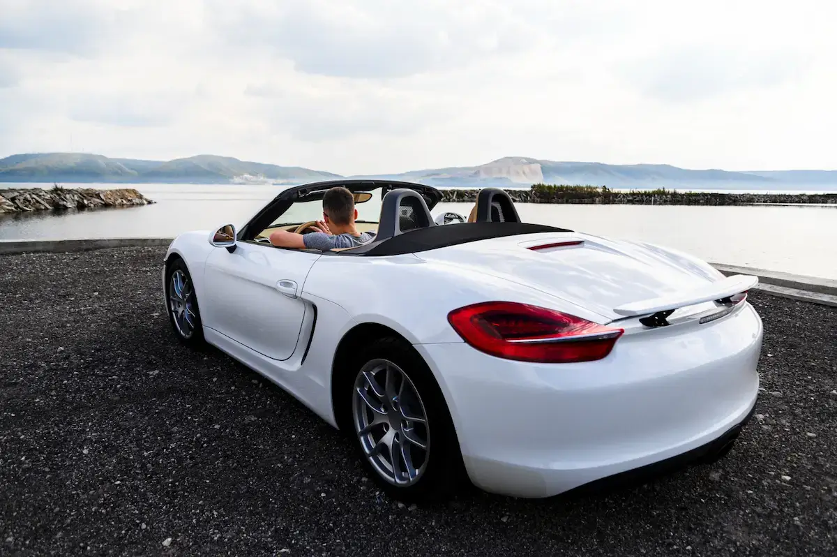 White sports car on the beach