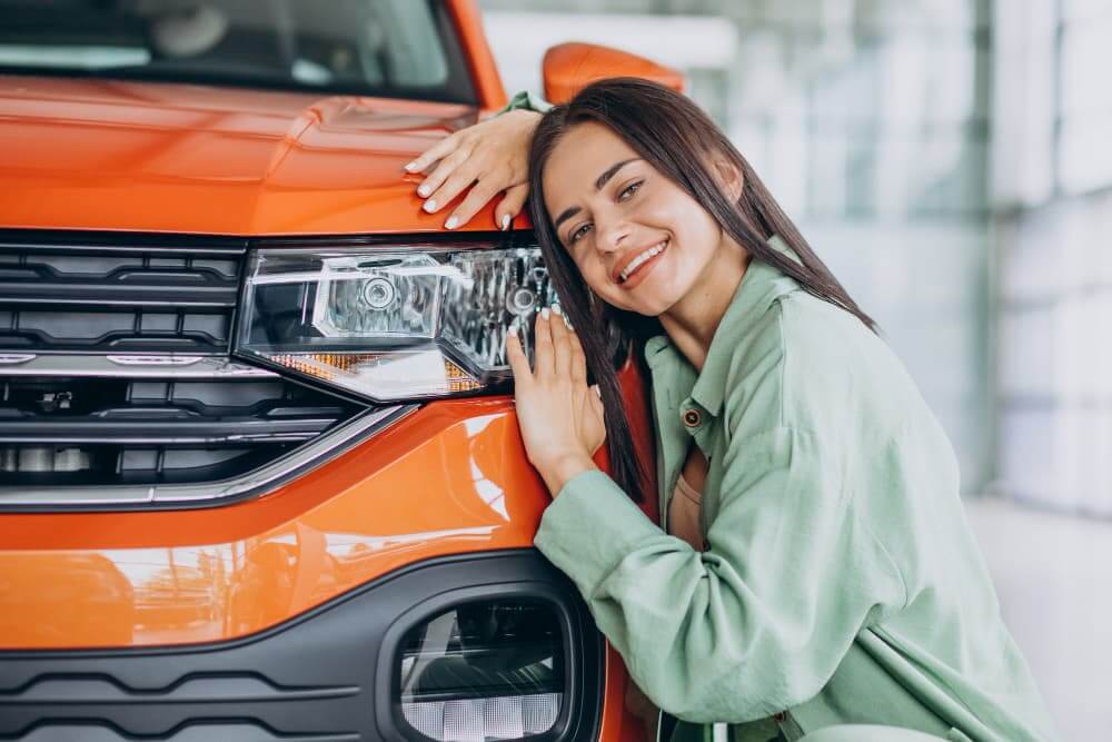 Woman with orange car