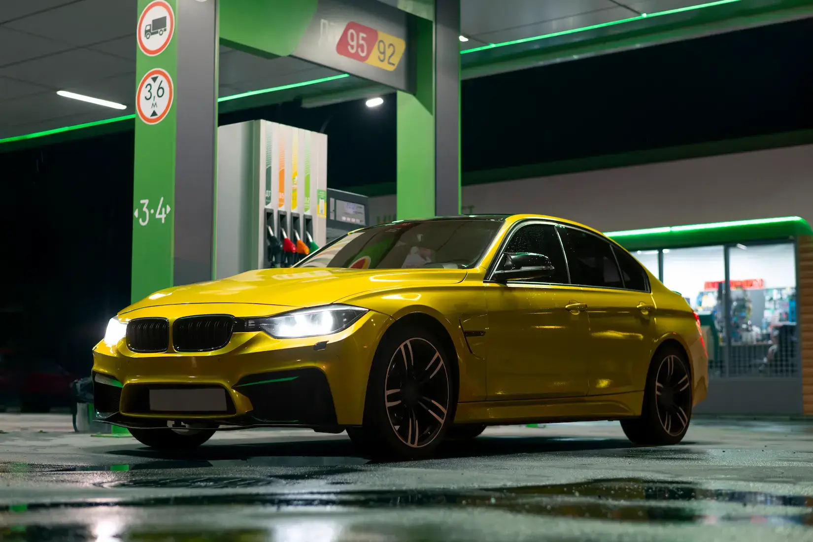 Yellow car at a gas station